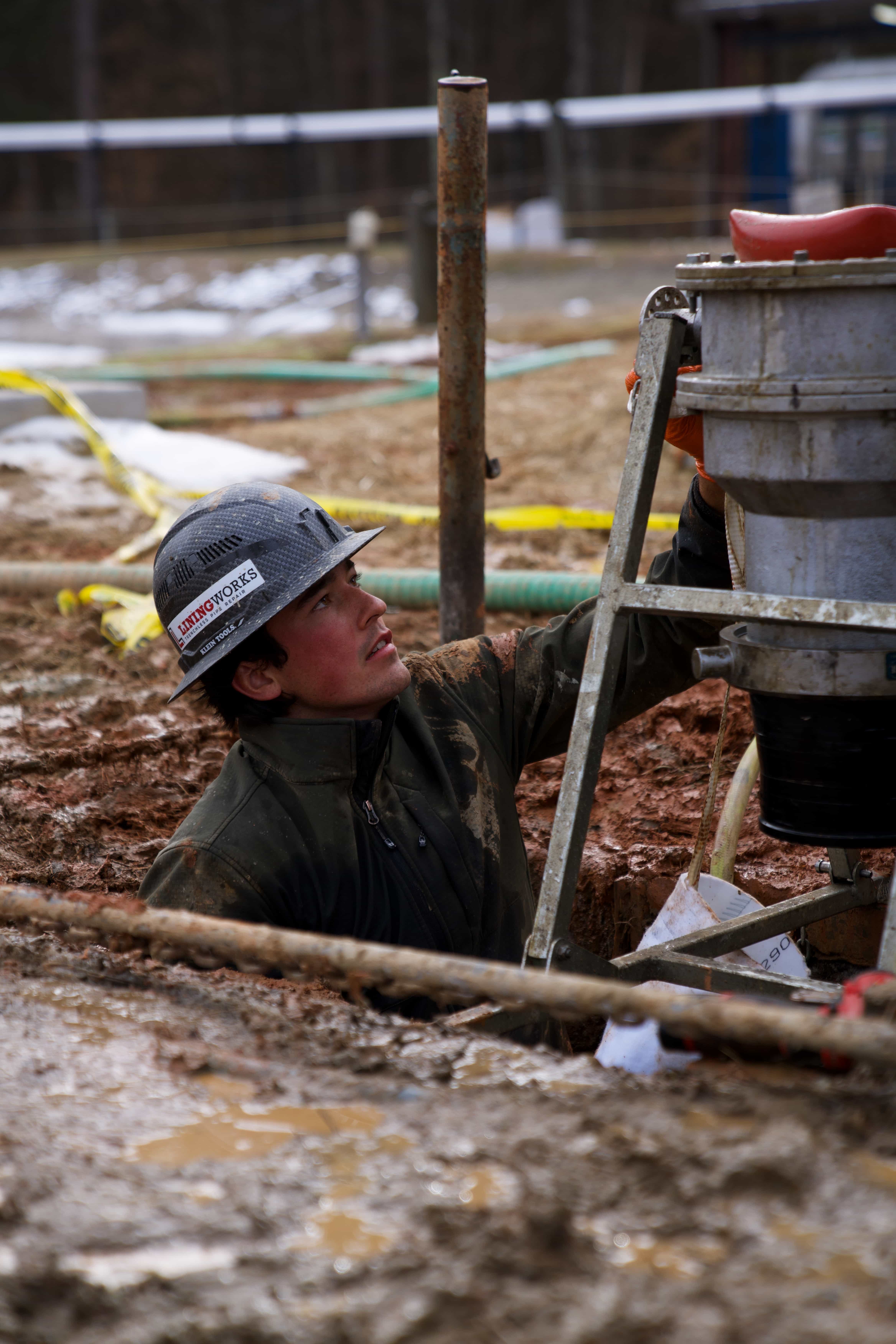 LiningWorks technician sewer pipe repair excavation
