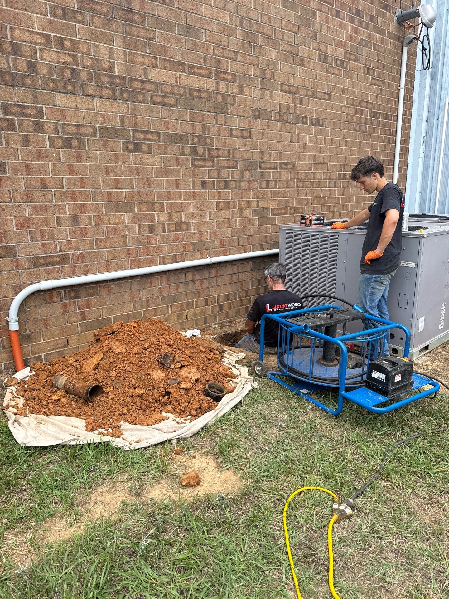 LiningWorks technician pipe repair excavation