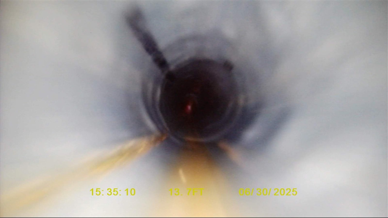 Sewer camera view of debris buildup blocking a residential line in Statesville, NC, before hydro jetting.