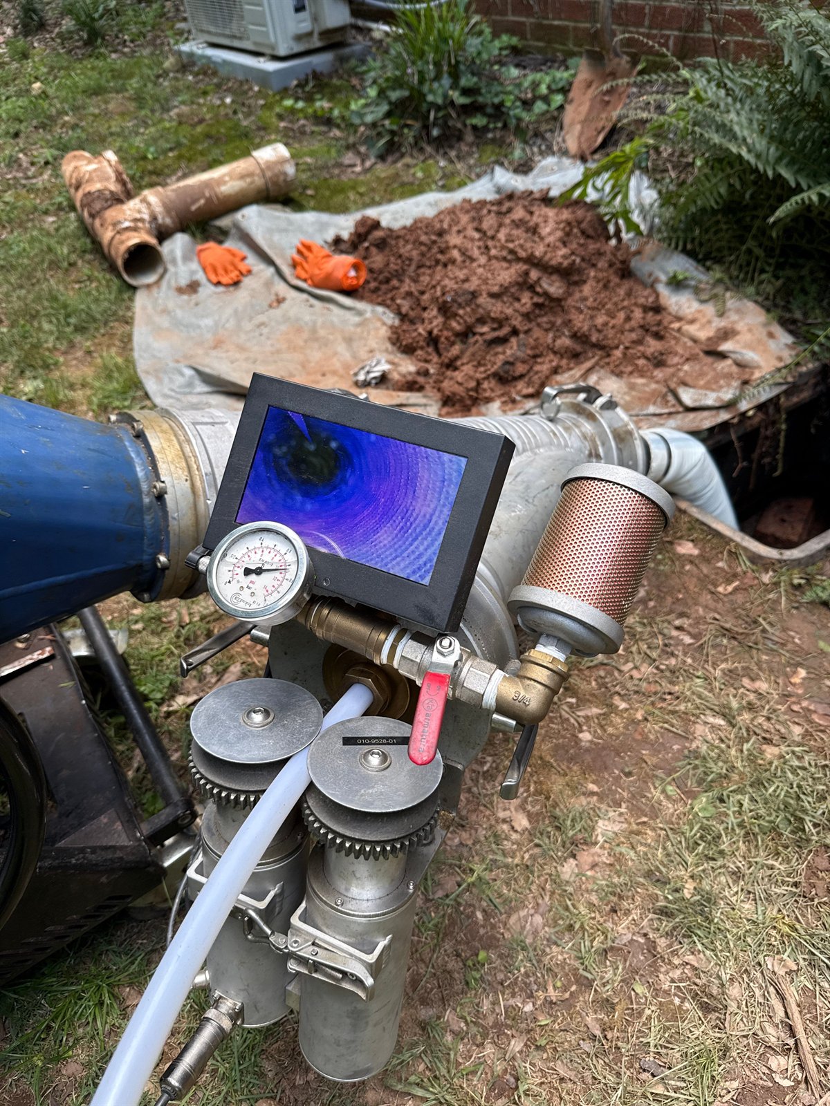 LiningWorks operating CIPP equipment with a live sewer camera feed to verify the finished liner.