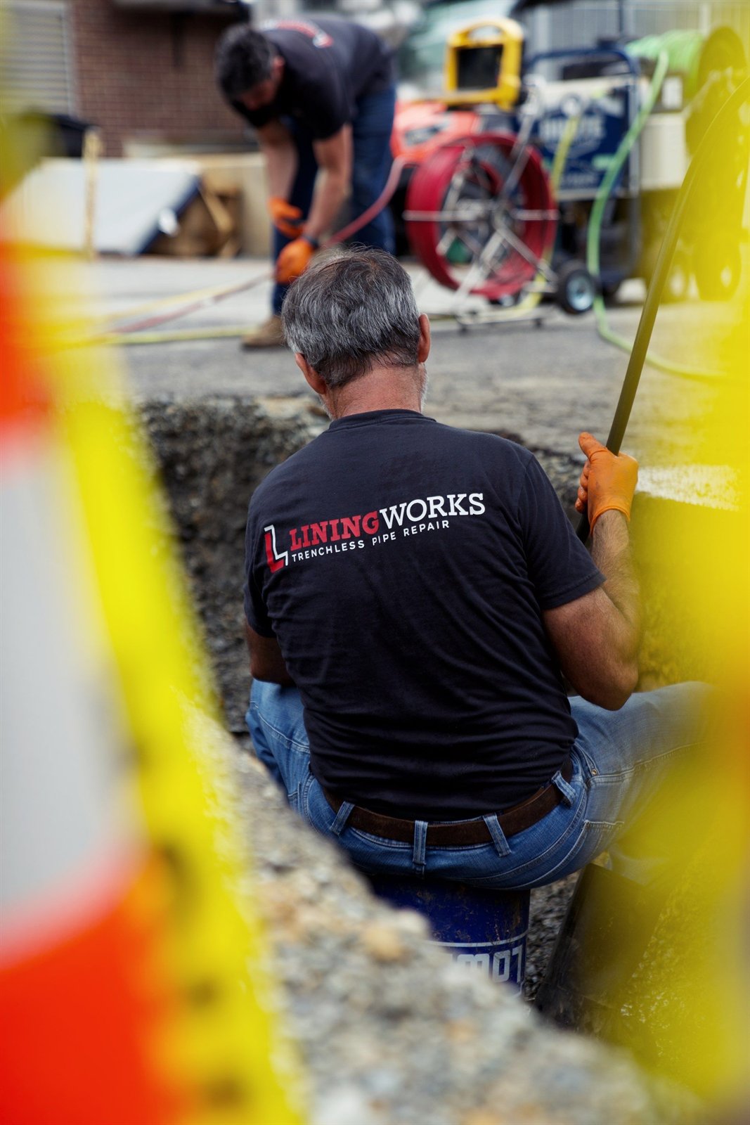 LiningWorks crew setting up equipment at the access pit to thread the new HDPE pipe.