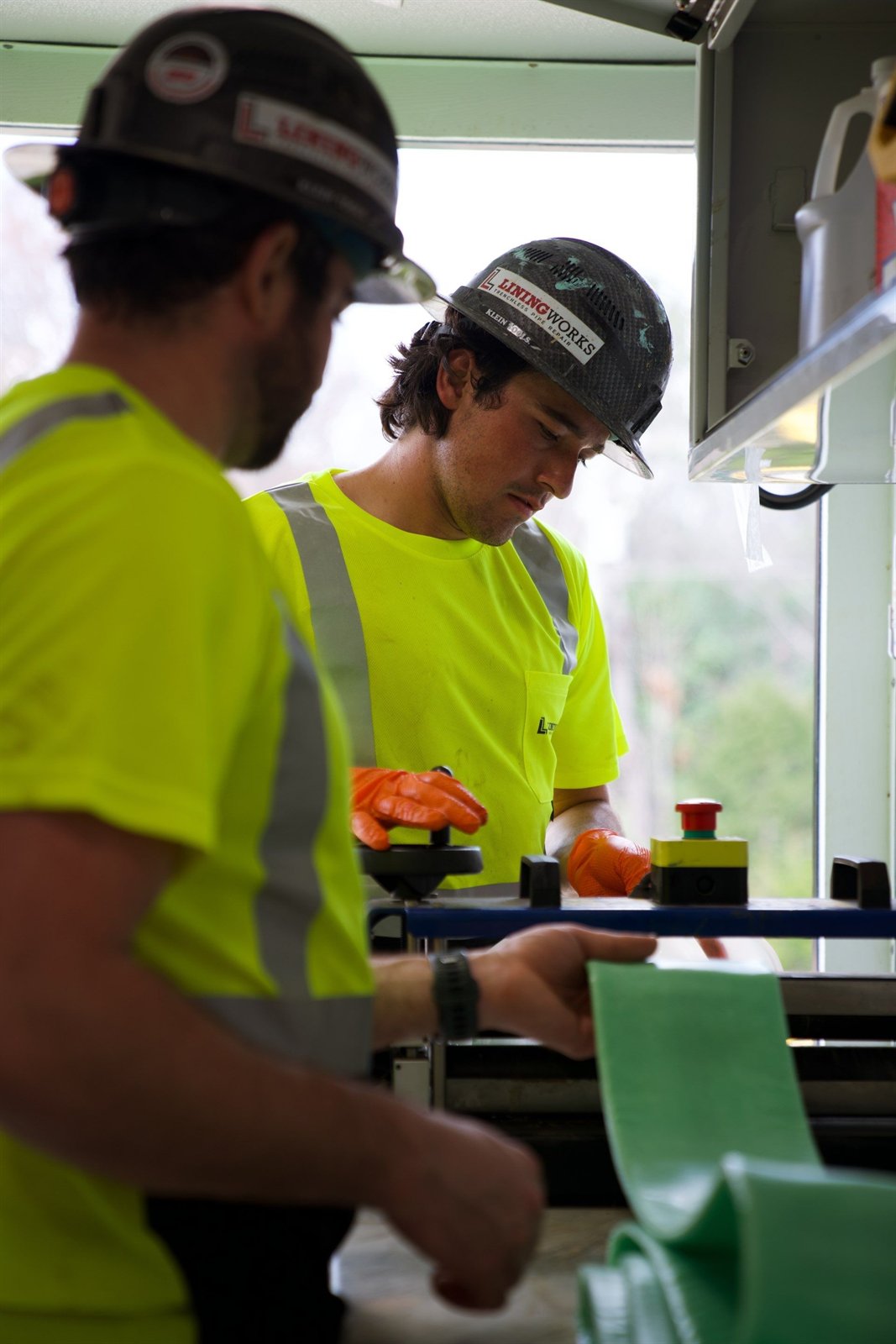 LiningWorks crew preparing a cured-in-place pipe liner for installation.