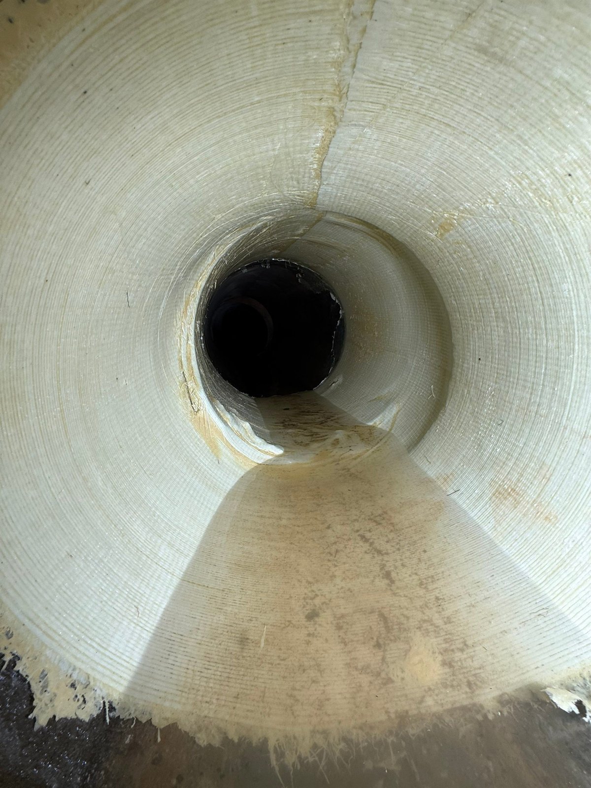 Interior of a newly installed cured-in-place liner with clear flow restored.