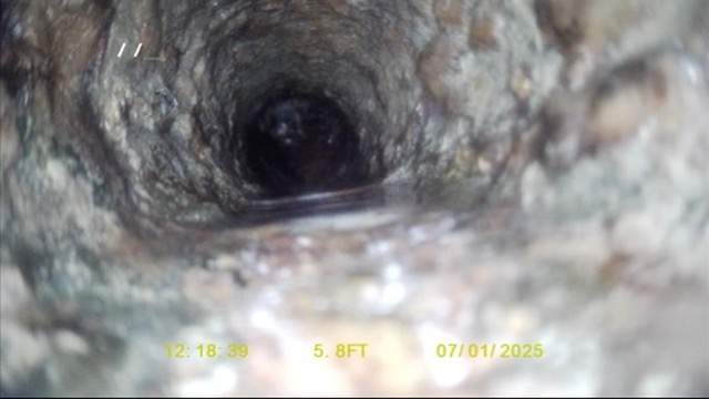 Sewer camera footage showing pipe deterioration found during a routine inspection.