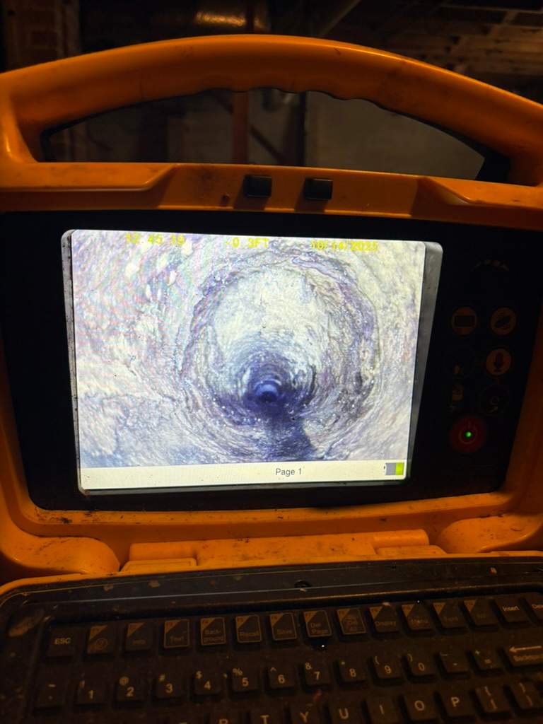 LiningWorks Trenchless Pipe Repair & Sewer Pipe Lining technician performing a digital pipe evaluation for a drain line