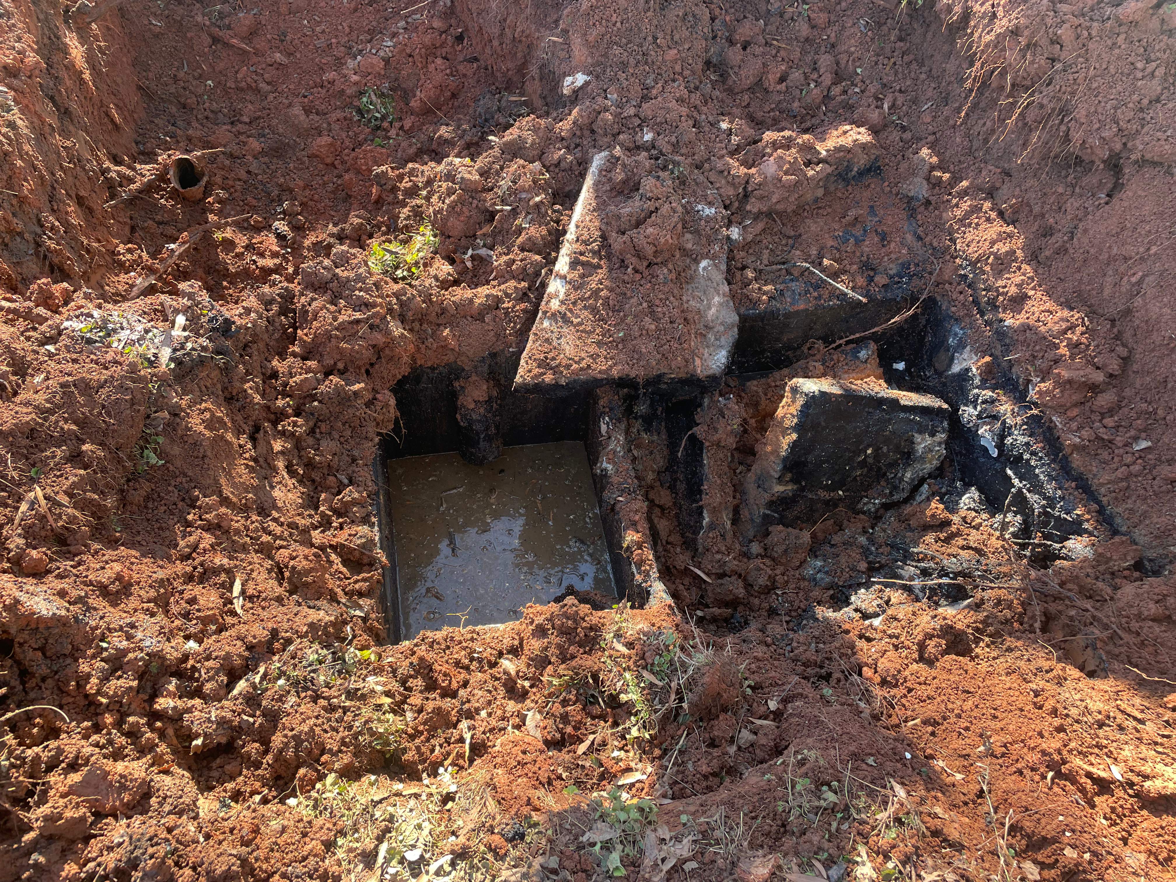 LiningWorks Trenchless Pipe Repair & Sewer Pipe Lining investigating a suspected sewer blockage with standing water
