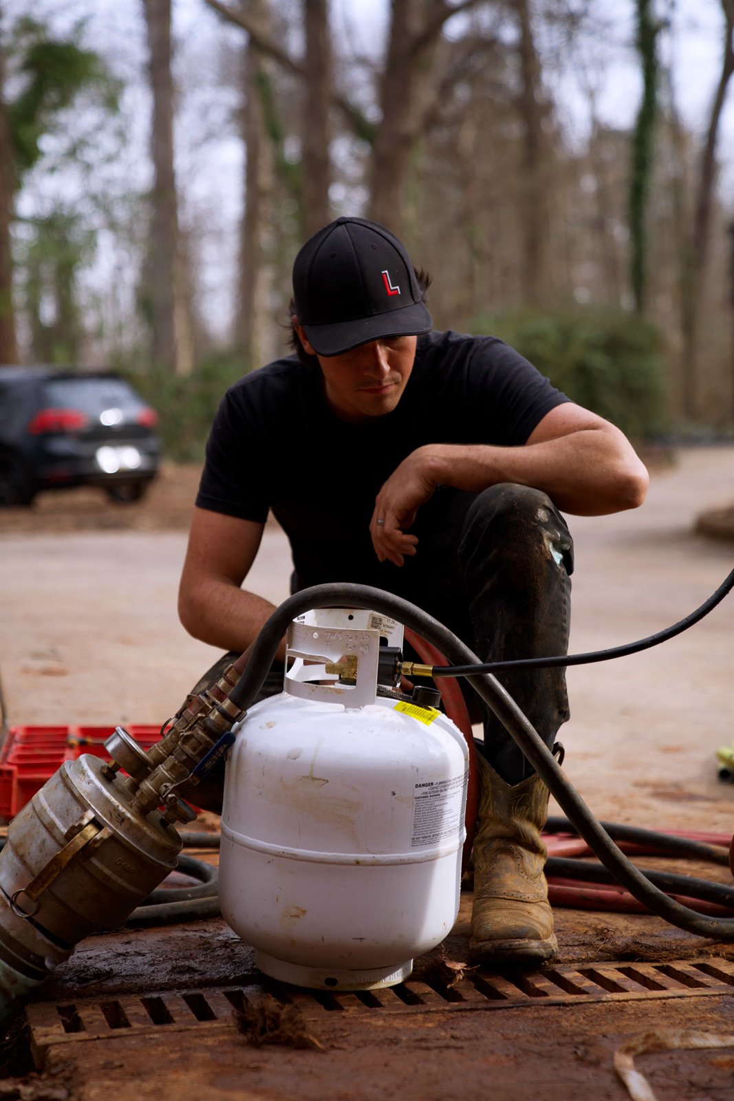 LiningWorks technician setting up CIPP pipe lining equipment, the Charlotte team to call when you see sewer line replacement problem signs.