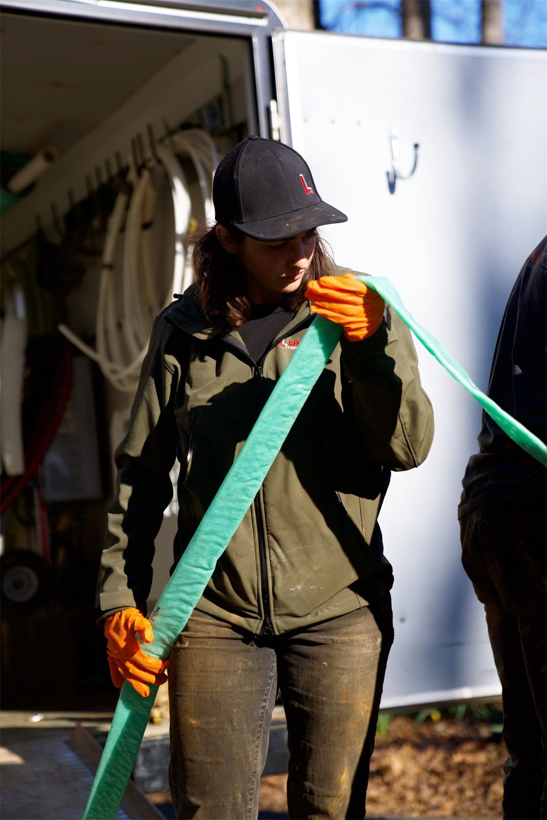 LiningWorks technician preparing a pipe liner on site for a sewer lining installation.